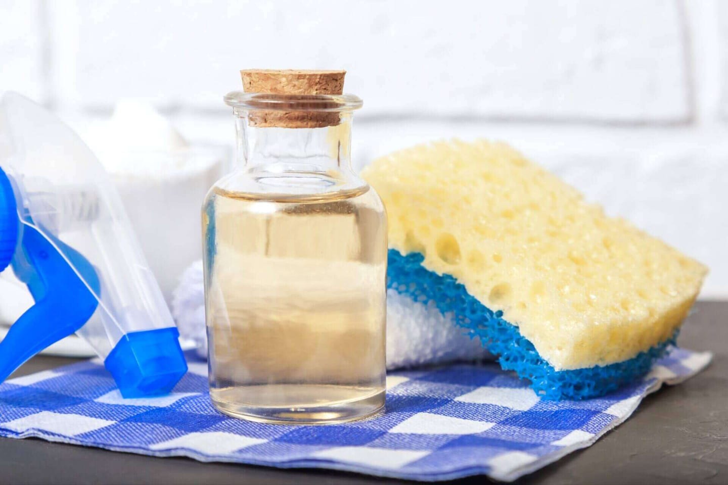 Apple cider vinegar along with a sponge used to clean mold from home