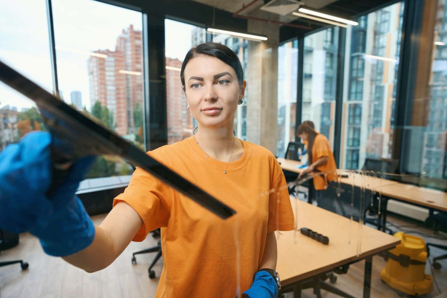 Commercial cleaning company workers cleaning an office