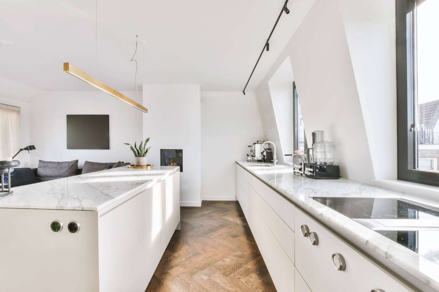 Kitchen with white quartzite countertops.