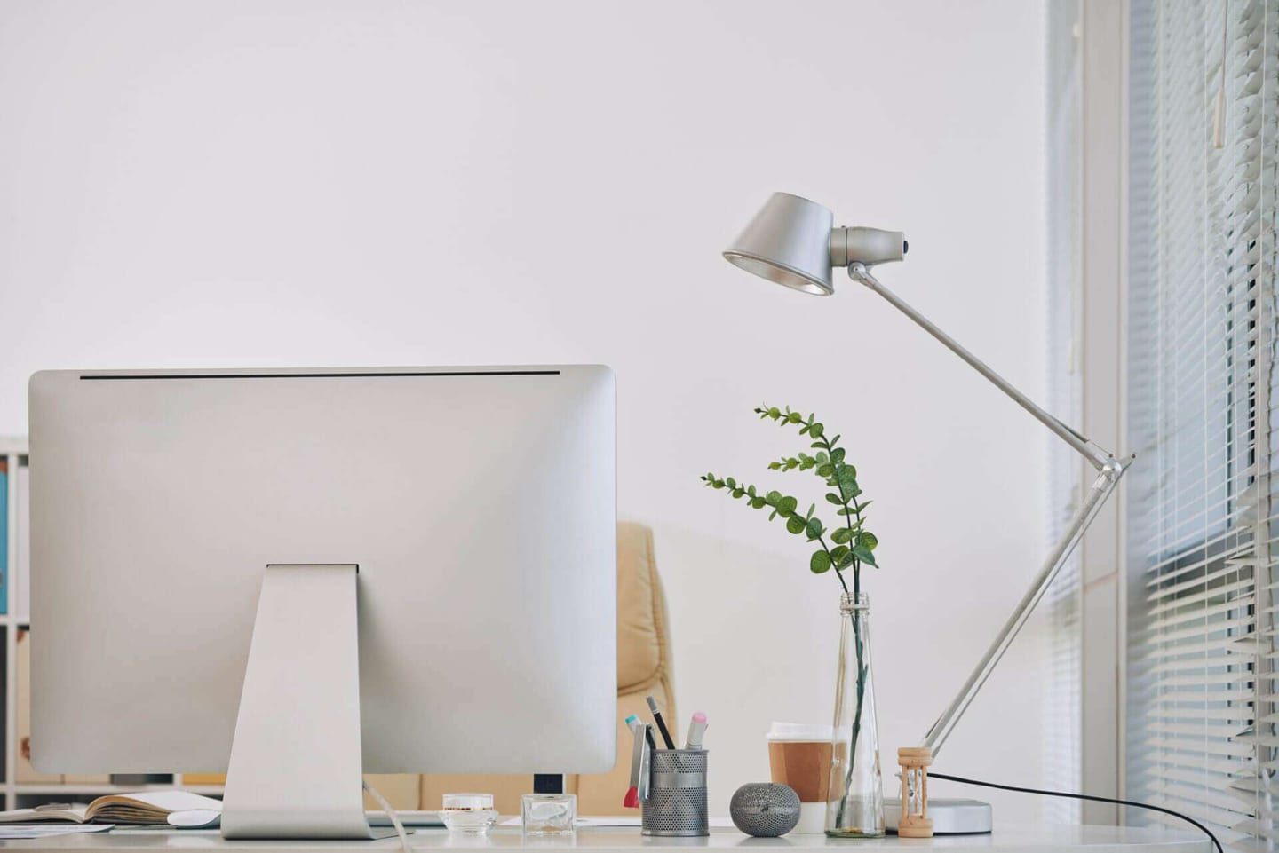 clean white office desk with a computer on it