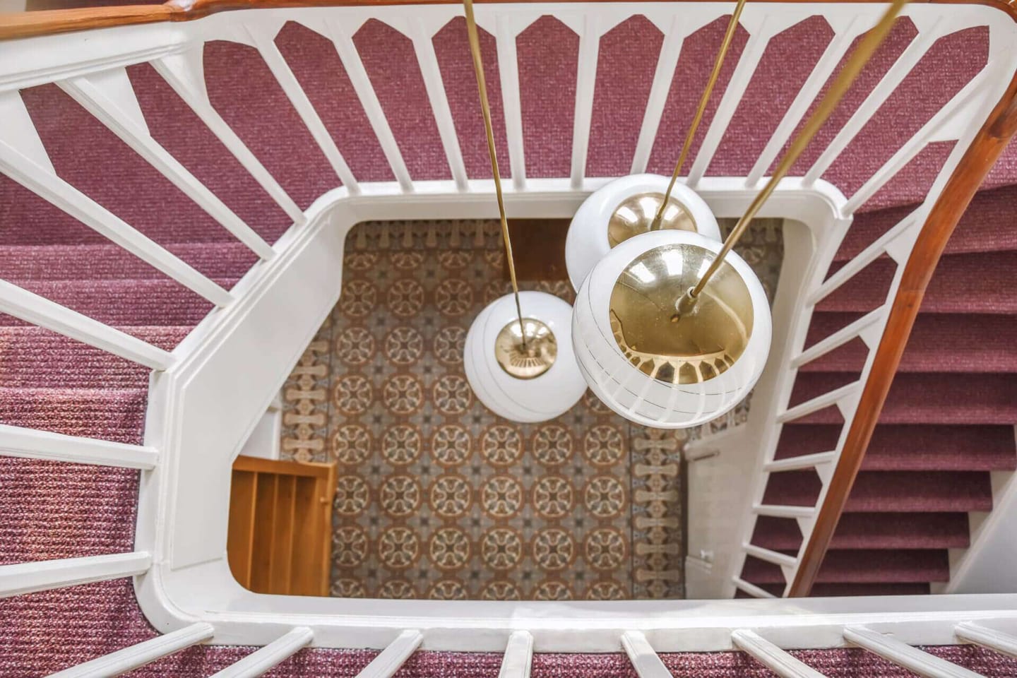 Big spiral stairways with red carpet
